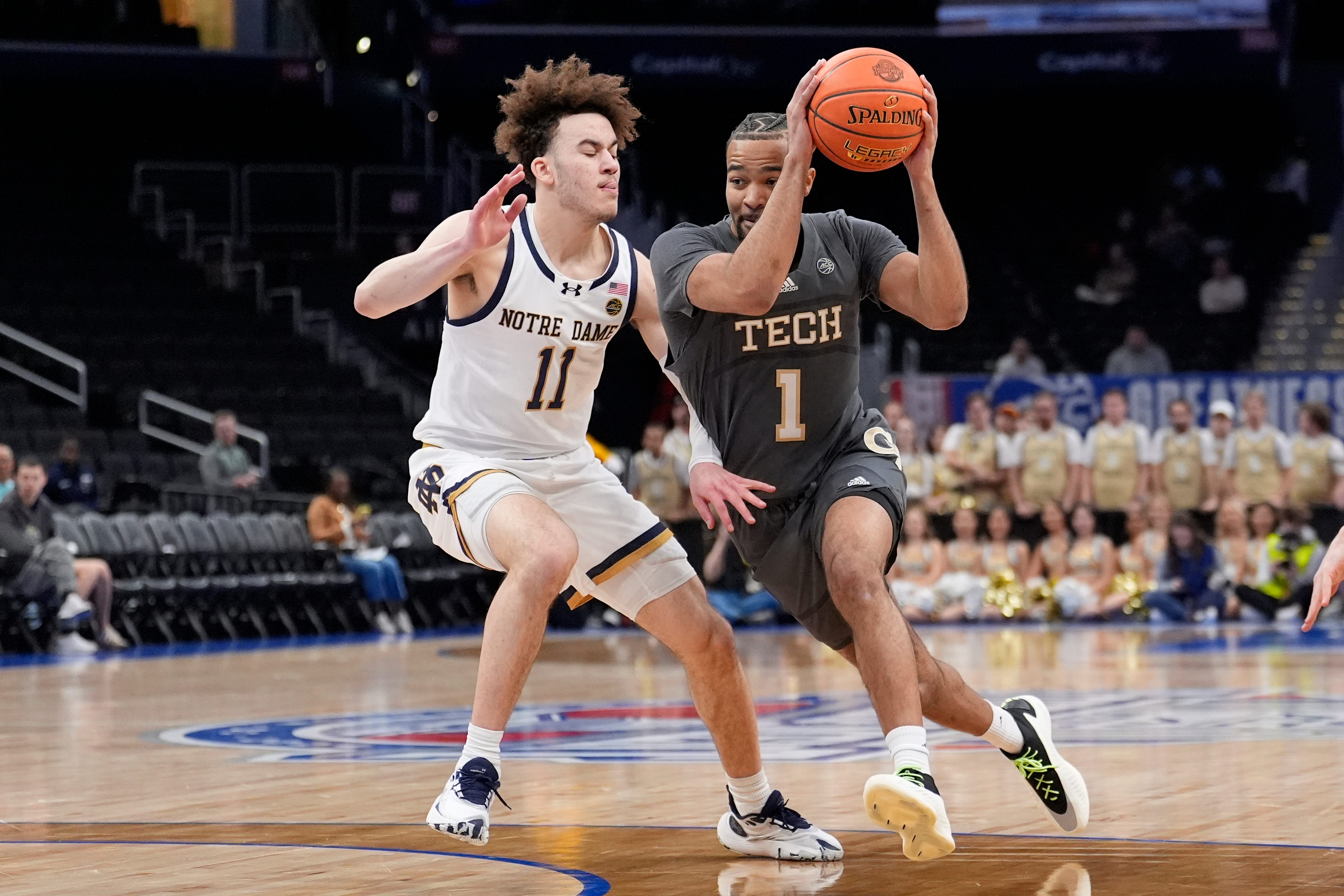 Georgia Tech guard Kyle Sturdivant (1) drives to the basket against Notre Dame guard Braeden Shrewsberry (11) during the first half of the Atlantic Coast Conference NCAA college basketball tournament, Tuesday, March 12, 2024, in Washington. (AP Photo/Alex Brandon)