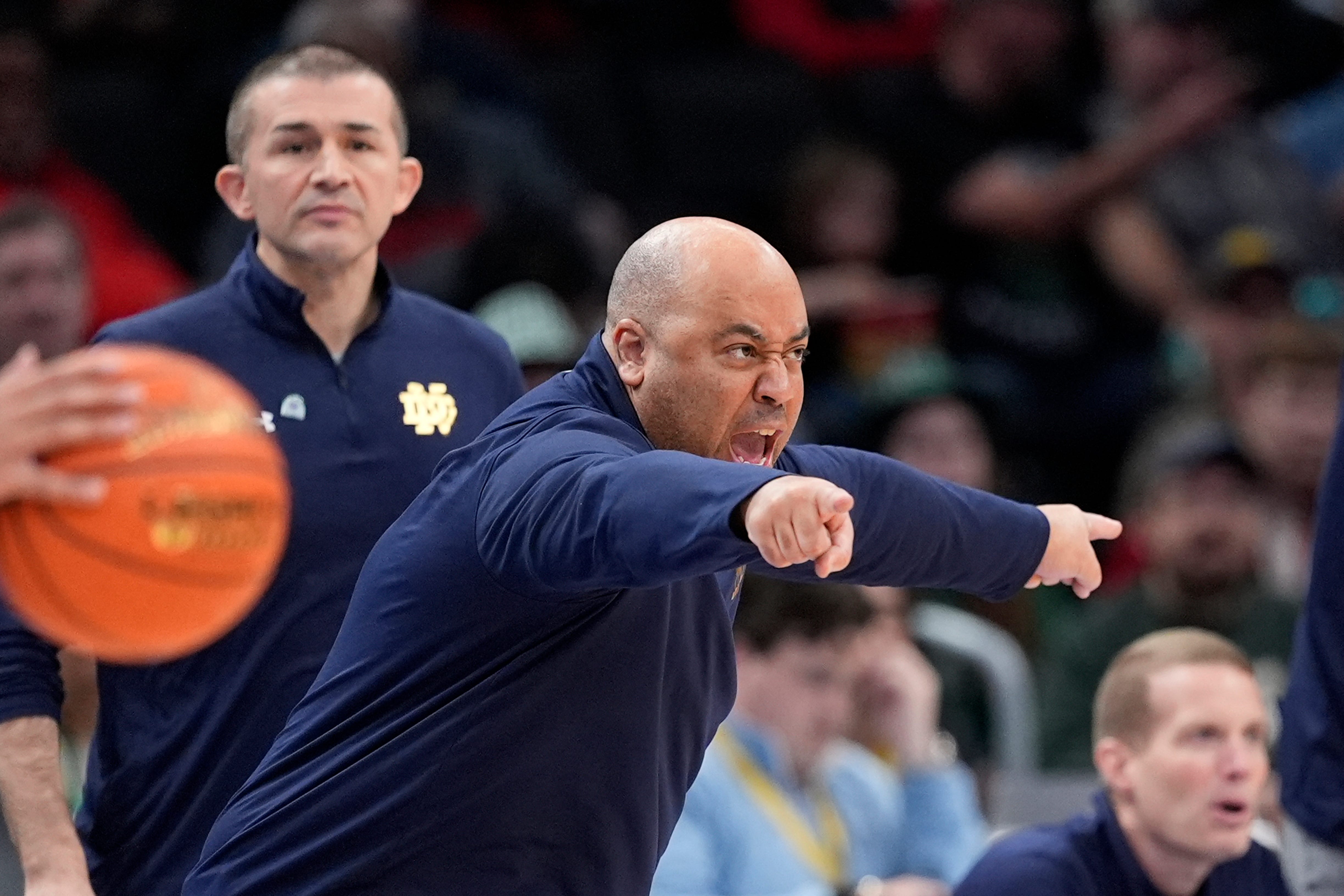 Notre Dame head coach Micah Shrewsberry gesturing to his players during the first half of the Atlantic Coast Conference NCAA college basketball tournament game against Georgia Tech, Tuesday, March 12, 2024, in Washington. (AP Photo/Alex Brandon)
