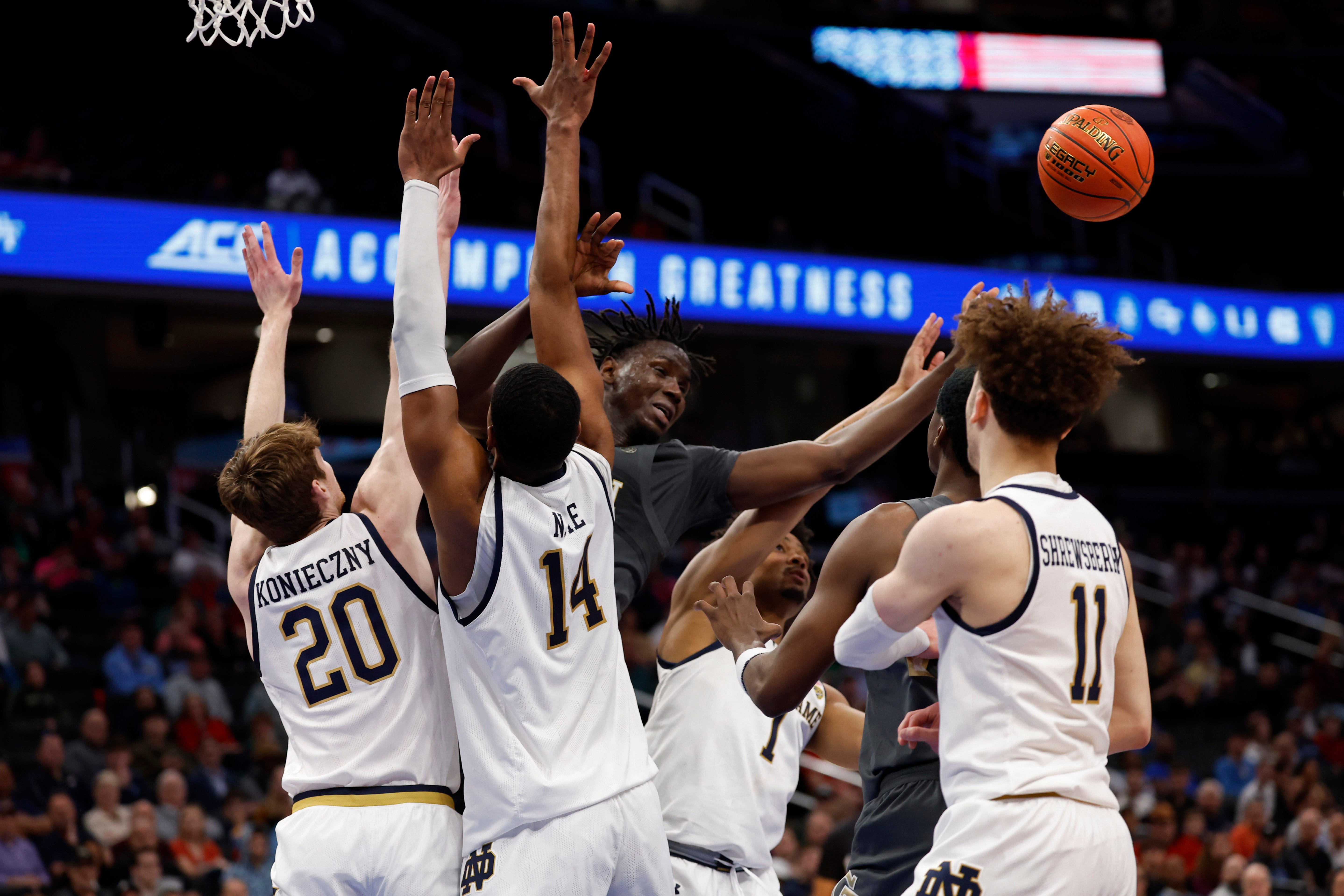 Mar 12, 2024; Washington, D.C., USA; Georgia Tech Yellow Jackets guard Miles Kelly (13) is fouled by Notre Dame Fighting Irish forward Kebba Njie (14) in the first half at Capital One Arena. Mandatory Credit: Geoff Burke-USA TODAY Sports