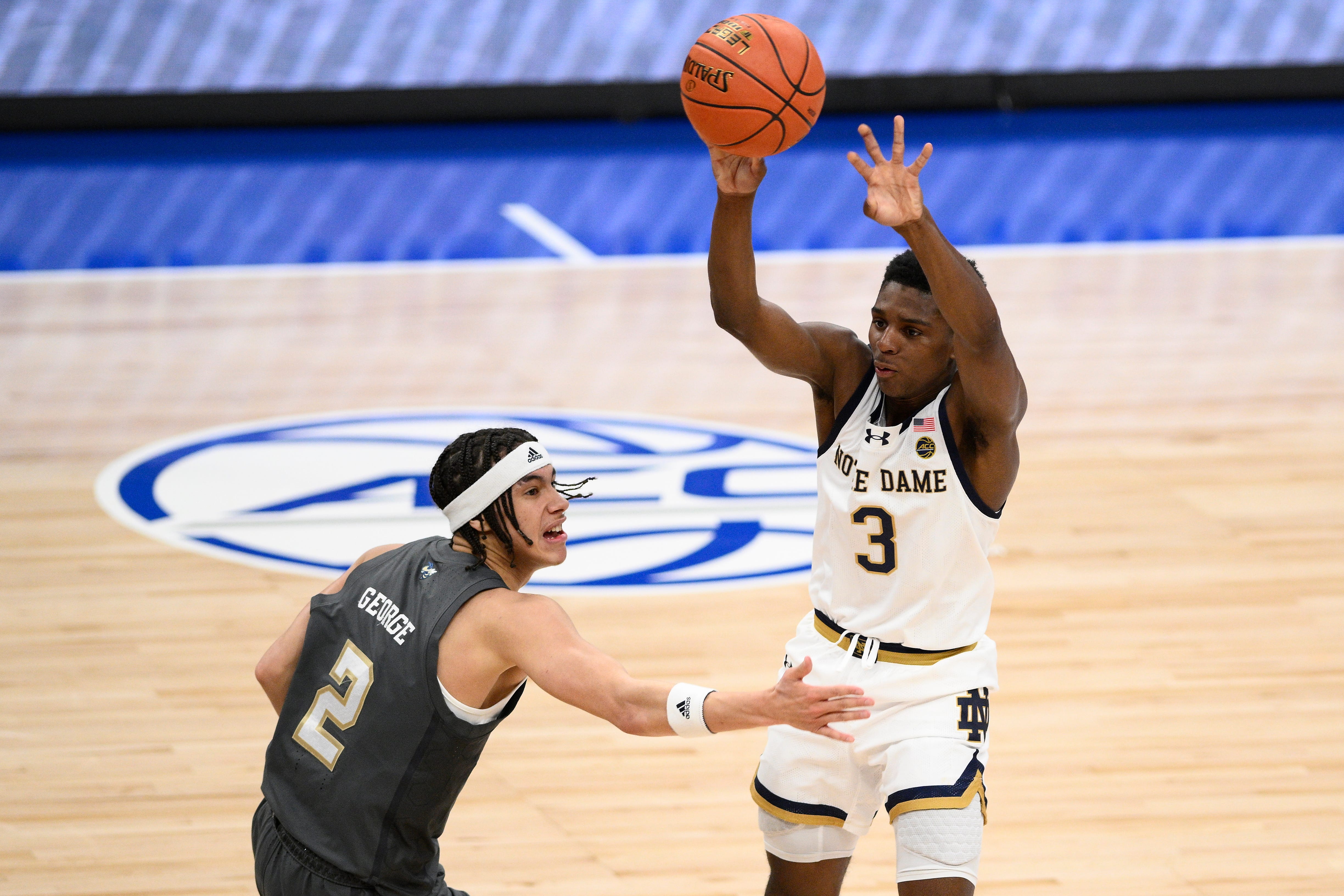 Notre Dame guard Markus Burton (3) passes the ball while playing against Georgia Tech guard Naithan George (2) during the first half of the Atlantic Coast Conference NCAA college basketball tournament, Tuesday, March 12, 2024, in Washington. (AP Photo/Nick Wass)