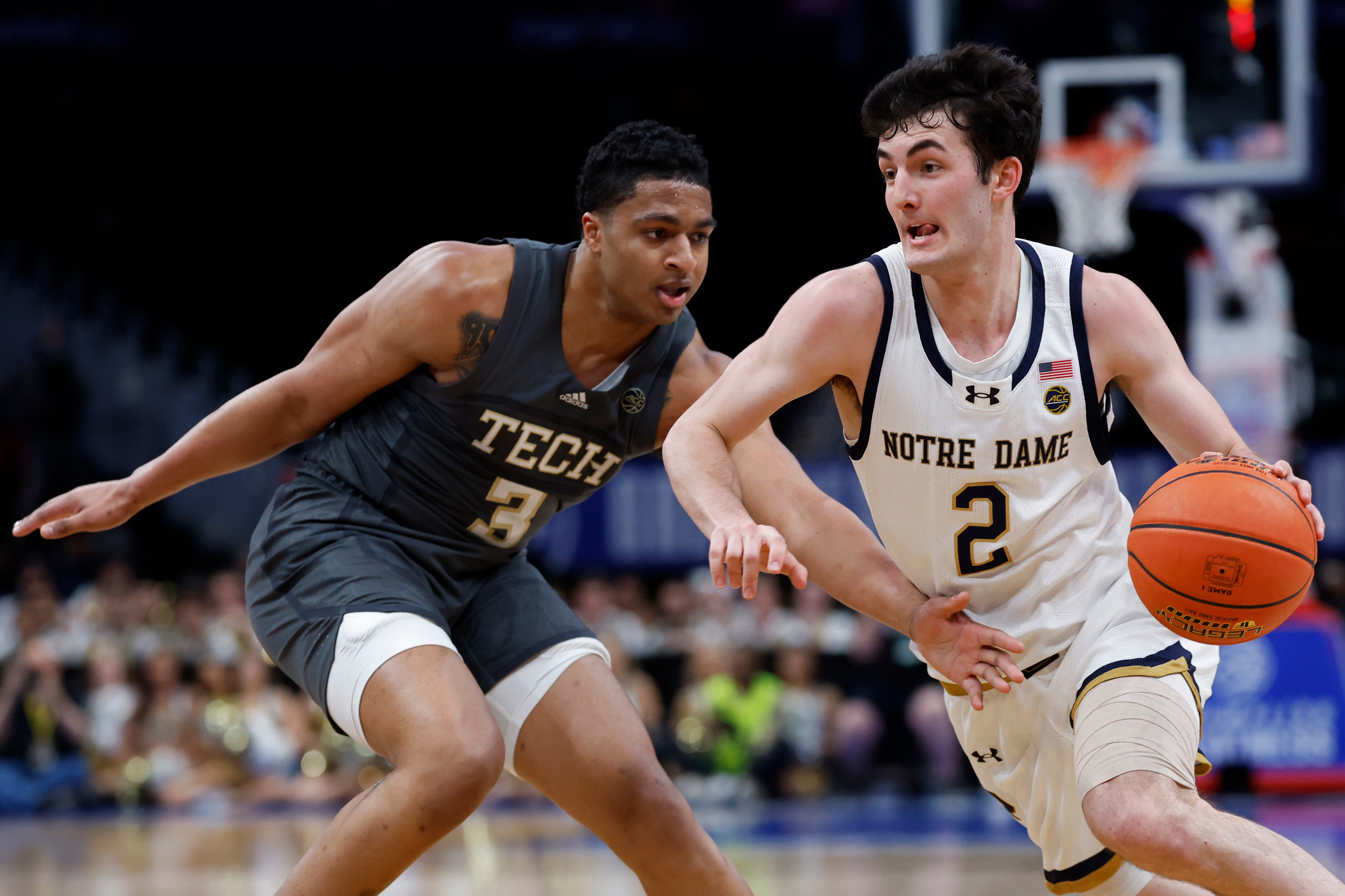 Mar 12, 2024; Washington, D.C., USA; Notre Dame Fighting Irish guard Logan Imes (2) drives to the basket as Georgia Tech Yellow Jackets guard Dallan Coleman (3) defends in the second half at Capital One Arena. Mandatory Credit: Geoff Burke-USA TODAY Sports