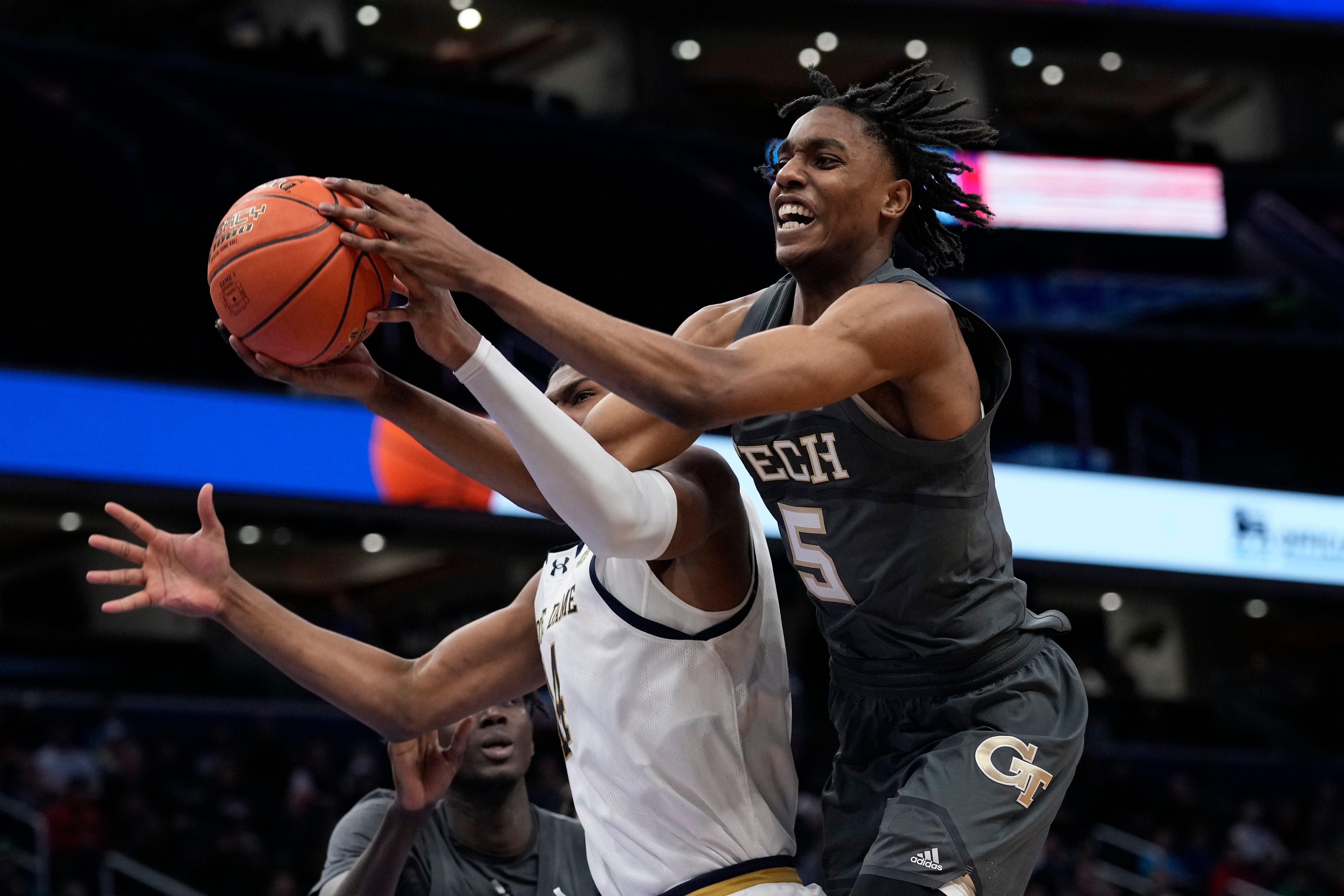Georgia Tech forward Tafara Gapare (5) and Notre Dame forward Kebba Njie (14) fight for control of the ball during the second half of the Atlantic Coast Conference NCAA college basketball tournament, Tuesday, March 12, 2024, in Washington. (AP Photo/Susan Walsh)
