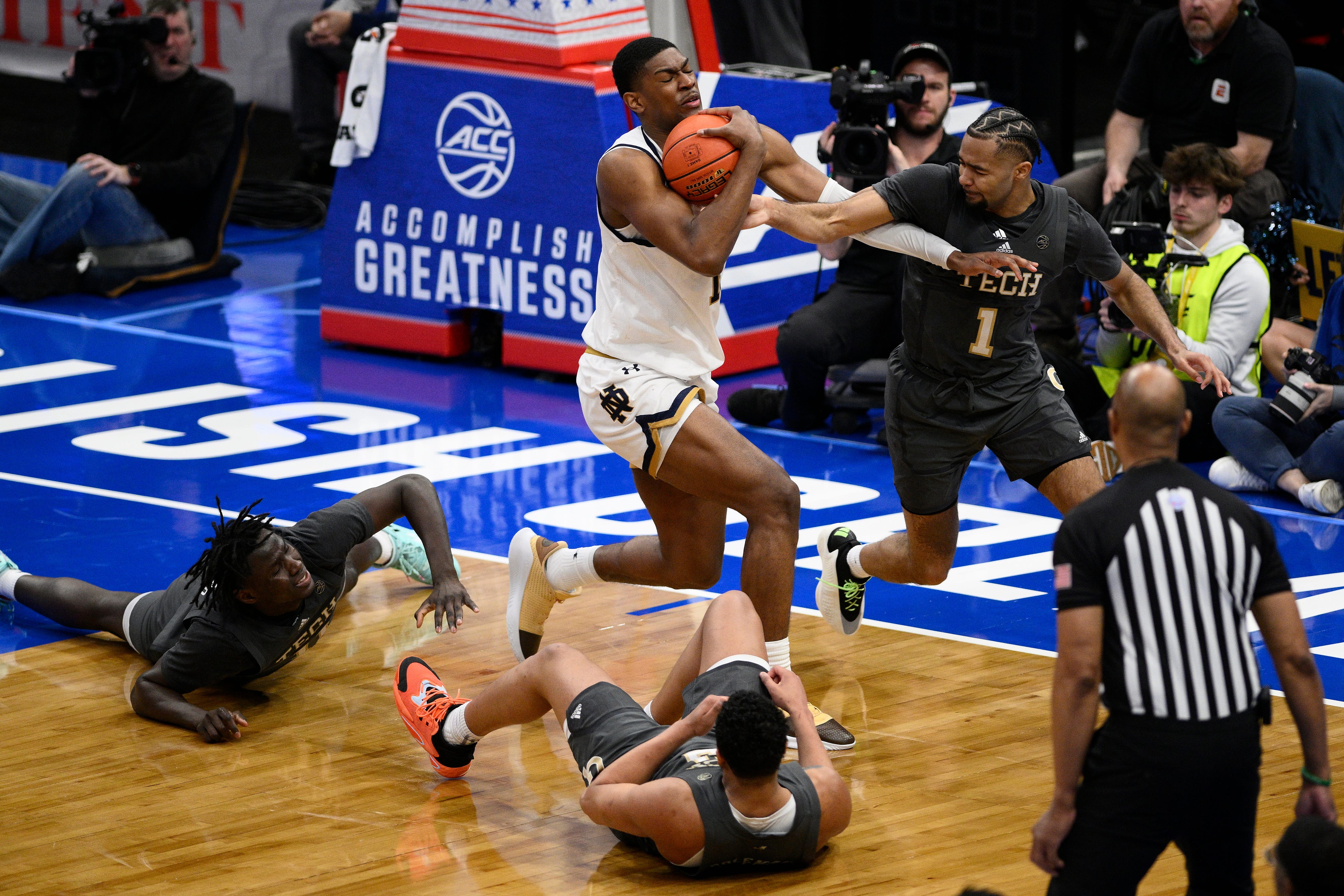 Notre Dame forward Kebba Njie (14) gains control of the ball against Georgia Tech guard Kyle Sturdivant (1) during the second half of the Atlantic Coast Conference NCAA college basketball tournament, Tuesday, March 12, 2024, in Washington. (AP Photo/Nick Wass)