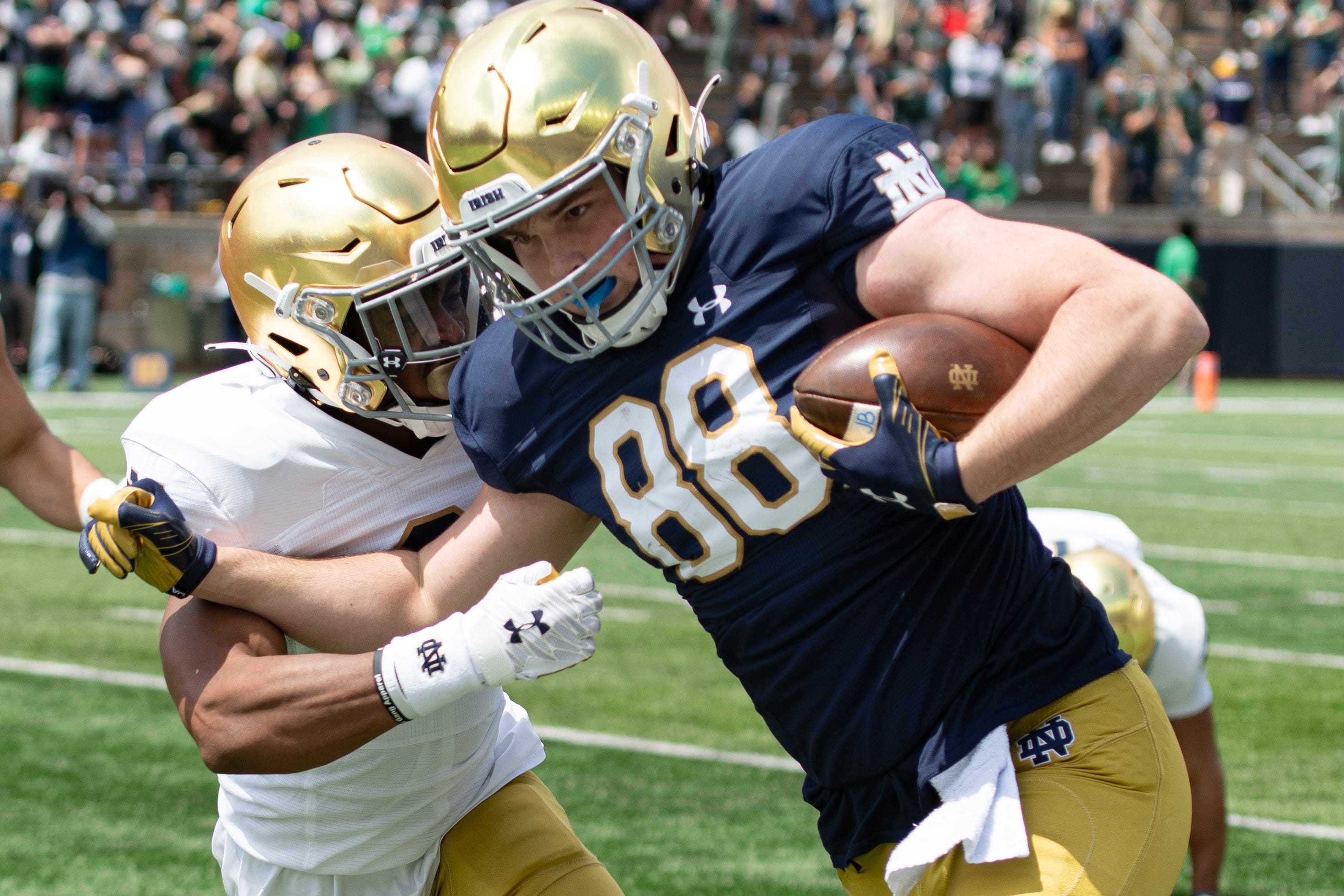 May 1, 2021; Notre Dame, Indiana, USA; Notre Dame Fighting Irish tight end Mitchell Evans (88) runs as safety Houstson Griffith (3) defends in the second half of the Blue-Gold Game at Notre Dame Stadium. Mandatory Credit: Matt Cashore-USA TODAY Sports