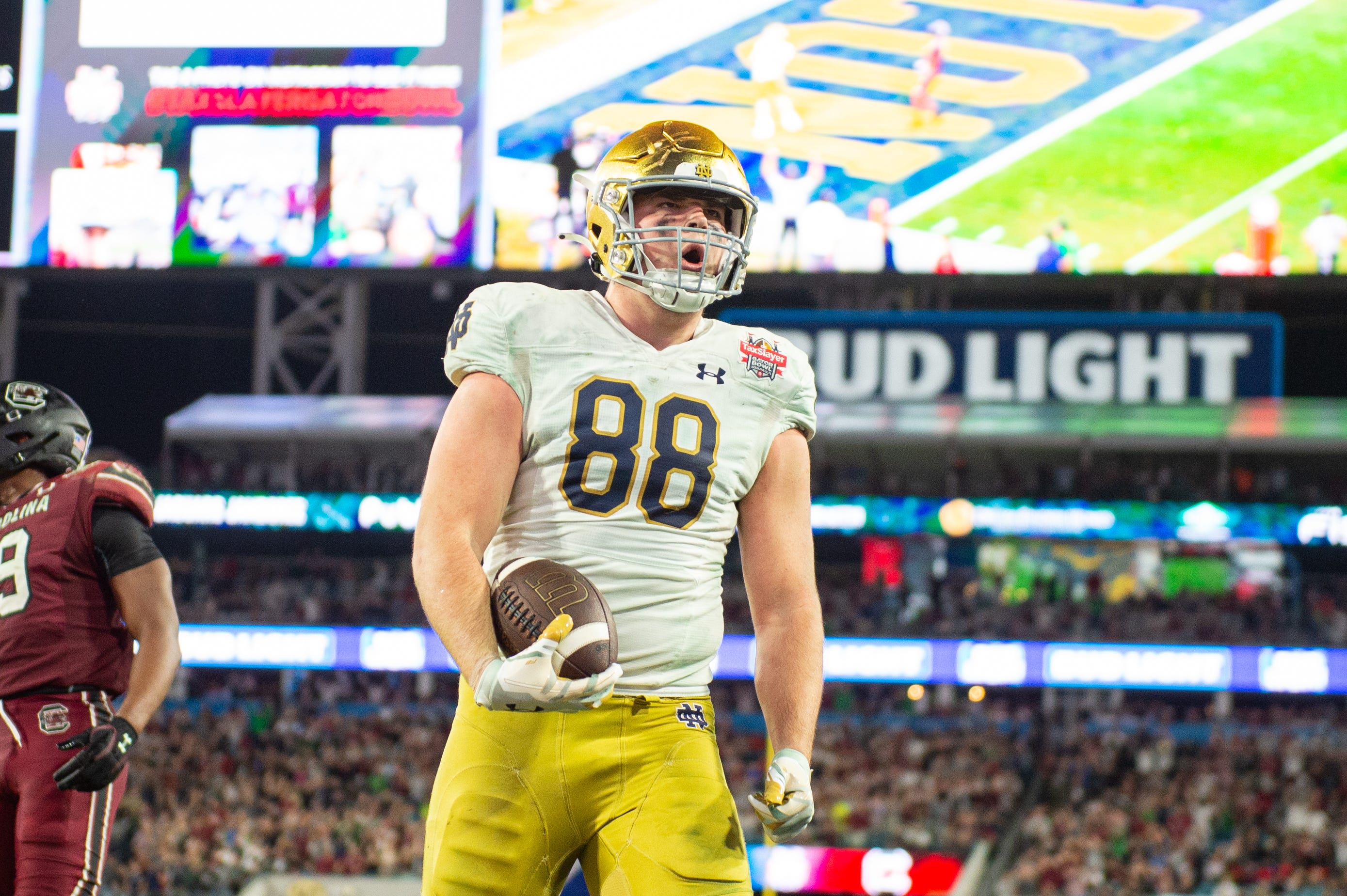 Dec 30, 2022; Jacksonville, FL, USA;Notre Dame Fighting Irish tight end Mitchell Evans (88) celebrates his touchdown against the South Carolina Gamecocks in the fourth quarter in the 2022 Gator Bowl at TIAA Bank Field. Mandatory Credit: Jeremy Reper-USA TODAY Sports