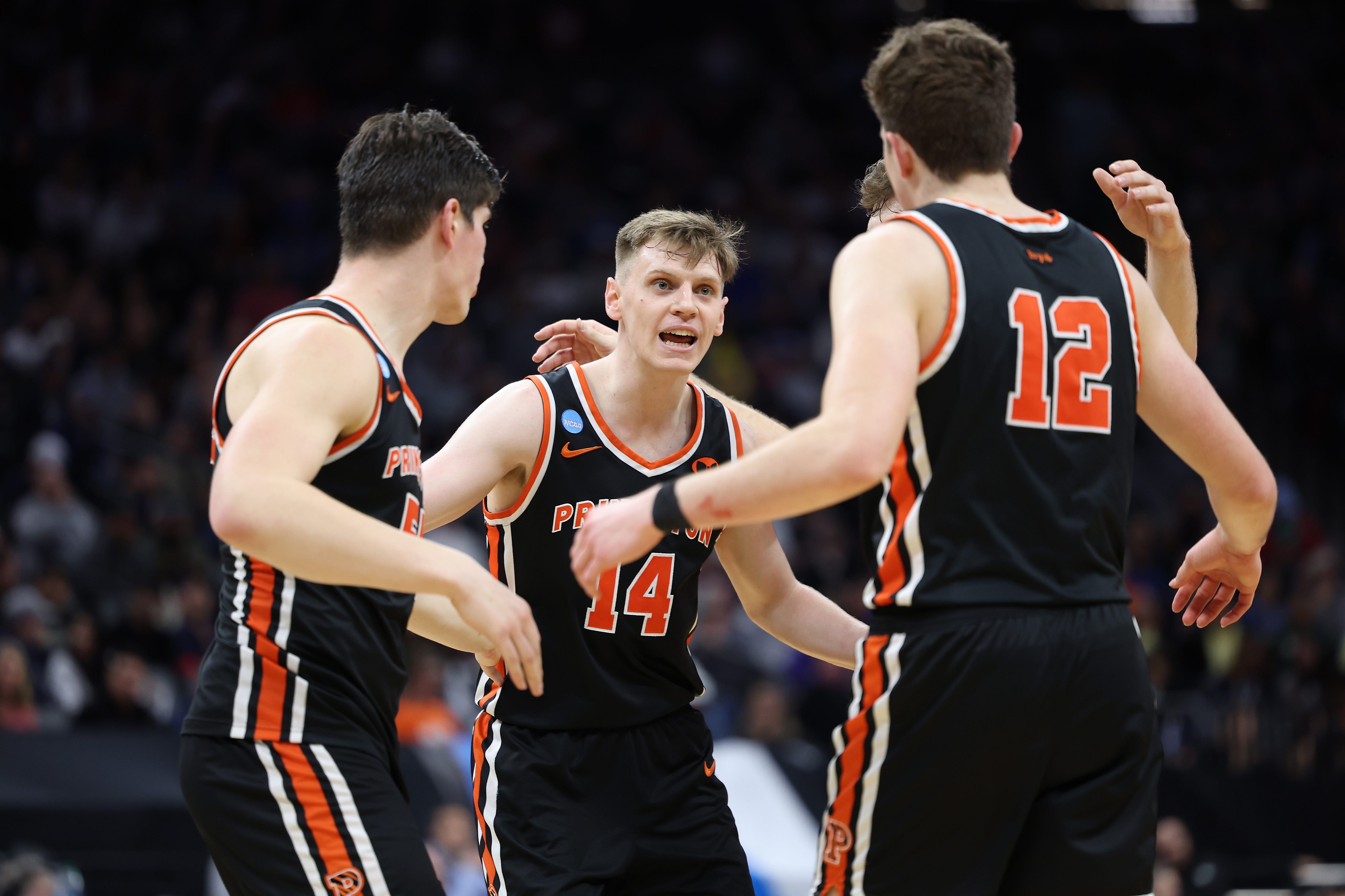 Mar 16, 2023; Sacramento, CA, USA; Princeton Tigers guard Matt Allocco (14) gathers with forward Caden Pierce (12) and forward Zach Martini (54) against the Arizona Wildcats during the second half at Golden 1 Center. Mandatory Credit: Kelley L Cox-USA TODAY Sports